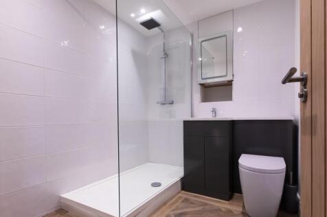 Contemporary tiled bathroom with large walk-in ...