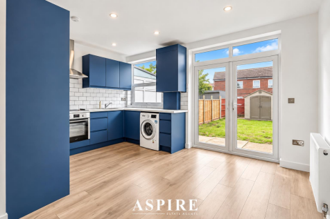 Bright Navy Kitchen with Garden View.png