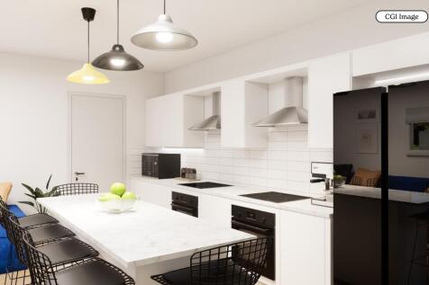Bright modern kitchen with island and seating...