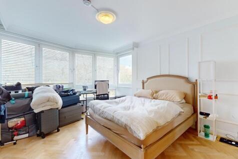 Bright bedroom with elegant parquet flooring...