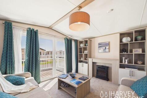 Regal Charmouth lounge with patio doors and deckin