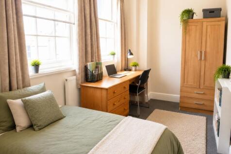 Bright, spacious room with large desk and stora...