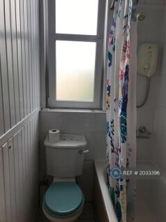 Bathroom With Bath And Electric Shower