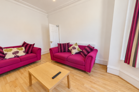 Bright Fuchsia Living Room with Bay Window