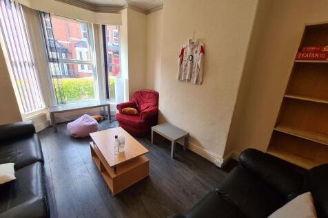 Bright and welcoming living room with ample sea...