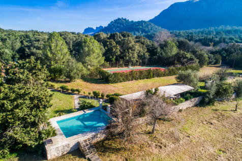View of the tennis court and second pool