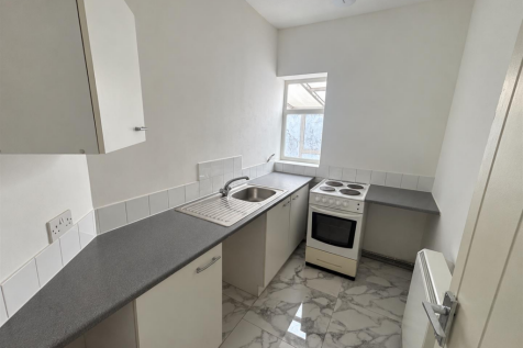 Clean Minimalist Galley Kitchen.png