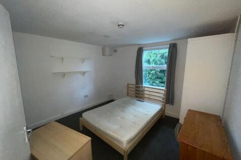 A spacious and bright double bedroom with ample...