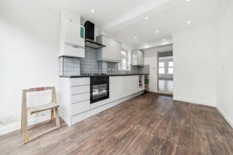 Bright modern kitchen with sleek white cabinets...