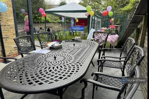 View Of Shared Garden Table &amp; Chairs