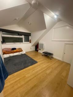 Cosy attic bedroom with sloped ceilings, large ...