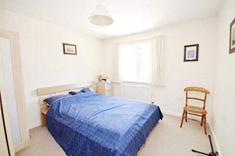 Bright, neutrally decorated double bedroom with...
