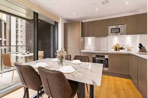 Experience culinary delight in this chic urban kitchen with cityscape views.