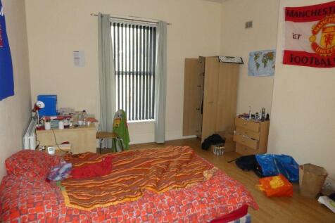 Cozy furnished bedroom with a single bed, wardr...