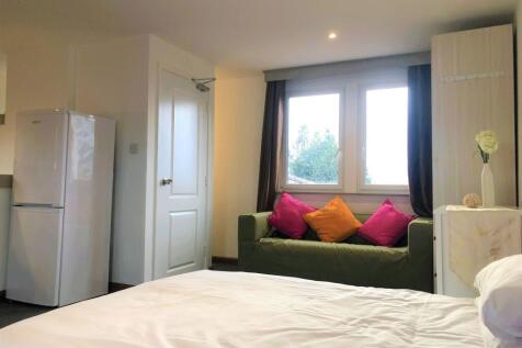 Bright and cozy double bedroom featuring a comf...