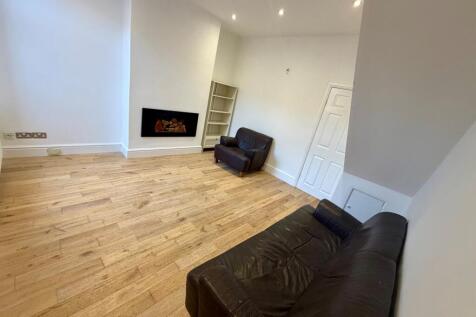 Bright, modern living room with wood flooring, ...