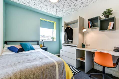 Bright, modern bedroom with a comfortable doubl...