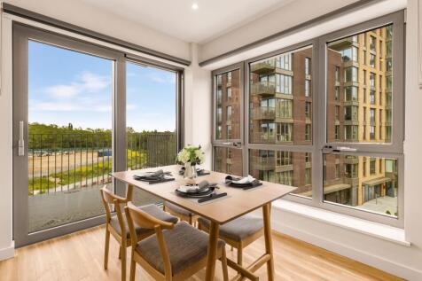 Experience city living with this elegant dining space that offers stunning urban views.