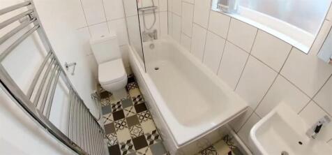 Bright bathroom suite with a modern bath...