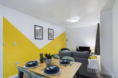 Bright, modern open-plan living area with a sty...