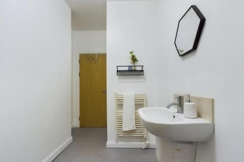 A clean and tidy bathroom featuring modern fixt...