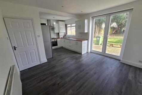 Bright modern kitchen with large garden doors...