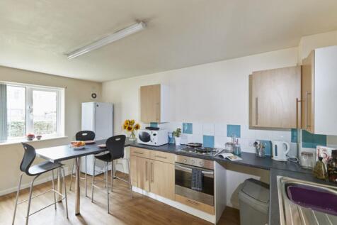 A spacious and bright kitchenette featuring mod...