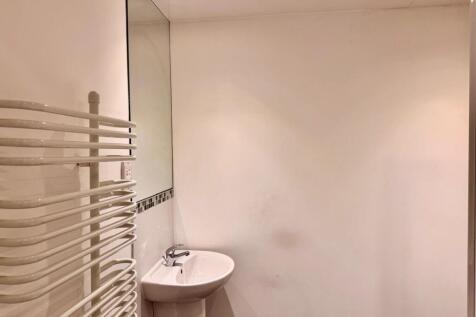Bright bathroom with heated towel rail....