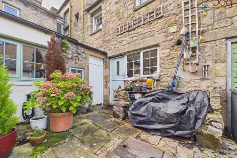 Shared stone-paved rear courtyard