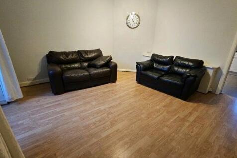 Bright lounge with ample social space and sofas...