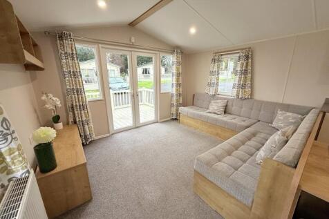 Bright Lounge With L Shaped Seating And Patio Door