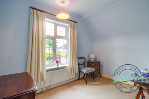 Spacious bedroom three with built in wardrobe