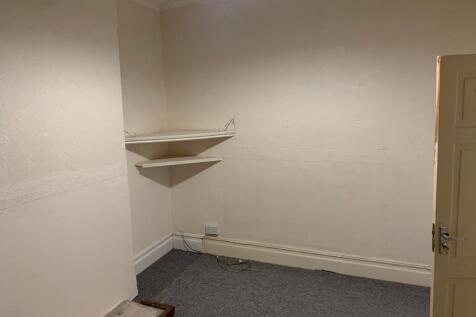 Bright bedroom corner with handy built-in stora...
