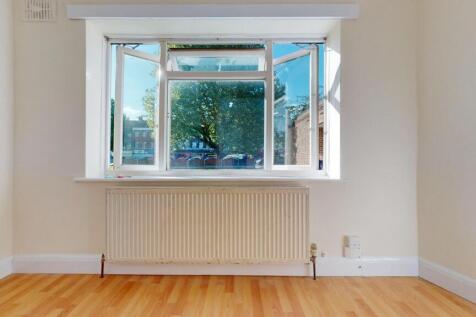 Bright, airy room with large sunlit window...