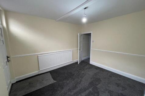 Freshly carpeted and neutral living space...
