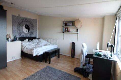 A bright and comfortable bedroom featuring a do...