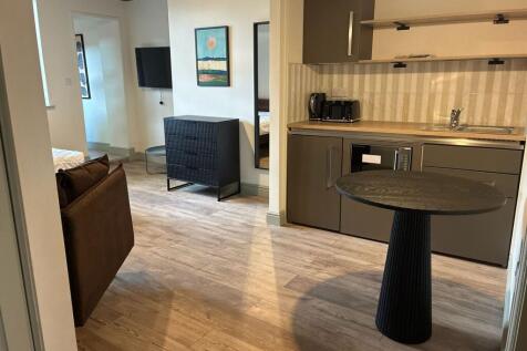 Modern studio kitchen with stylish dining area...