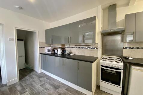 Modern kitchen with sleek grey cabinetry...
