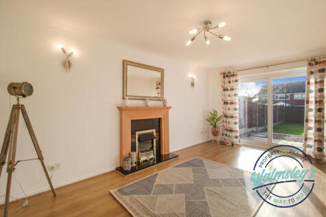 Sitting room to rear with patio doors