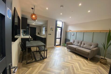 Bright, modern open-plan living area with styli...