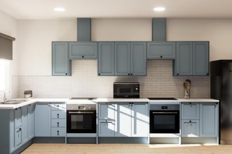 Modern kitchen with dual ovens and blue cabinet...