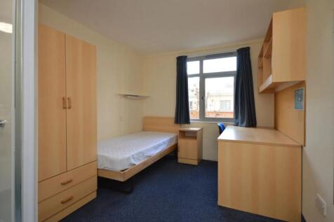Bright bedroom with desk and ample storage...