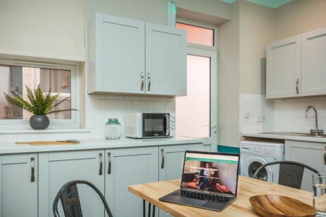 A bright and modern kitchenette featuring sleek...