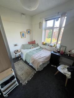 Bright bedroom with double bed and study desk...