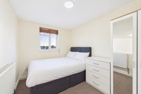 Neatly staged bedroom, ready for listing
