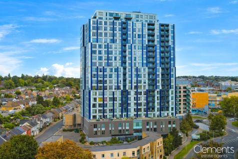 Modern high-rise over traditional suburb.png