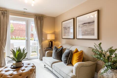 a living room with a couch and a lamp