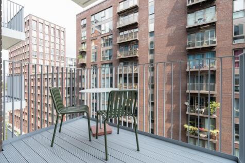 Experience city living with this charming balcony, perfect for relaxation.