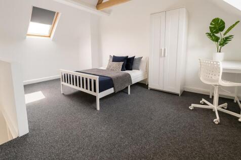 Bright and minimalist single bedroom featuring ...