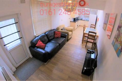 Bright open-plan living room with dining space...